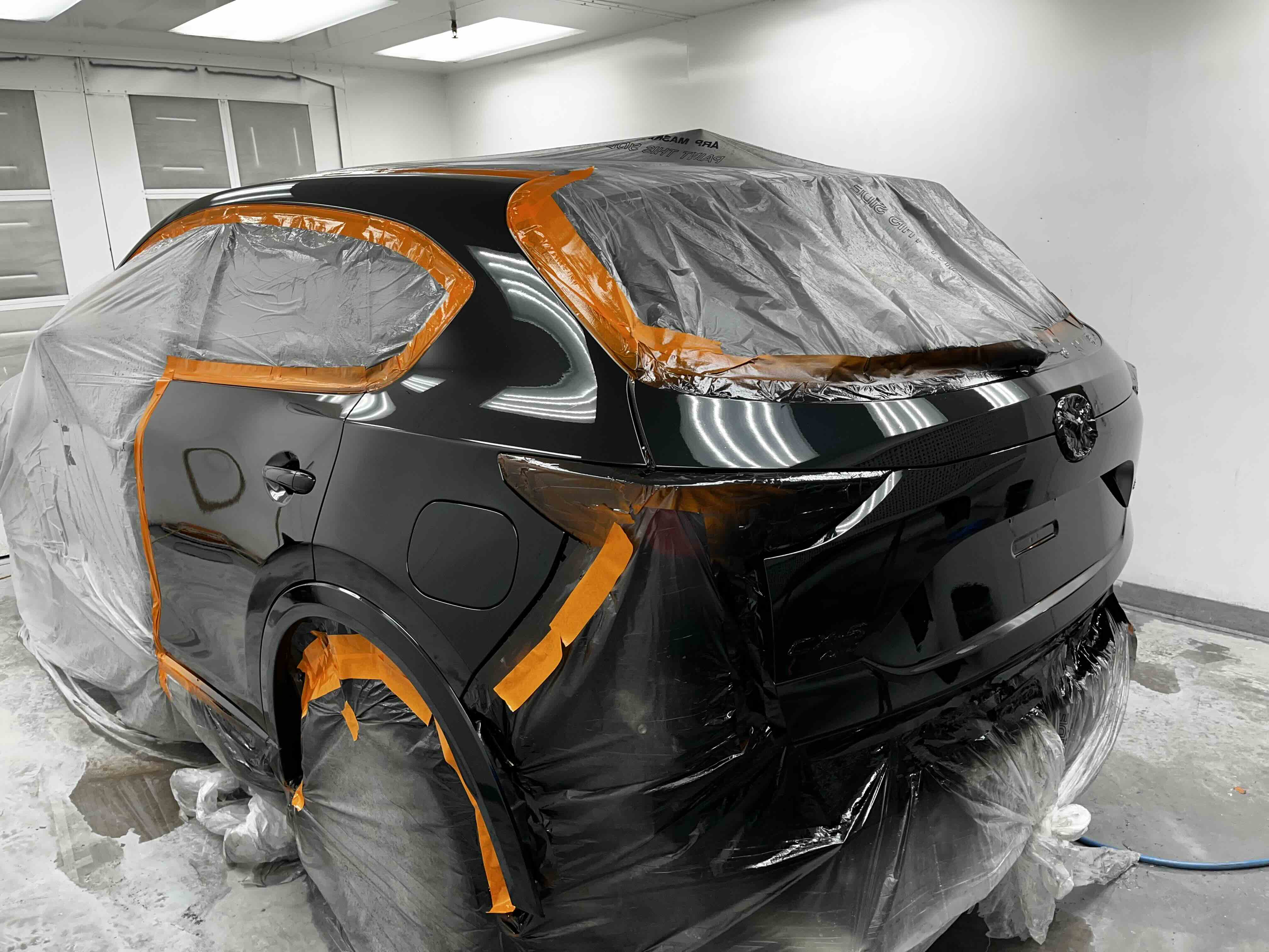 Mazda being painted in the Greensburg Auto spray booth